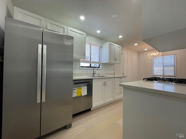 spare room with ceiling fan and light hardwood / wood-style floors