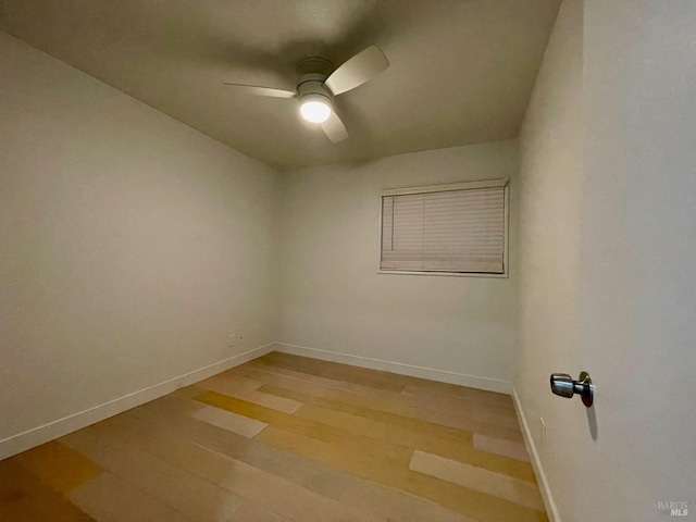 unfurnished room featuring ceiling fan and light hardwood / wood-style floors