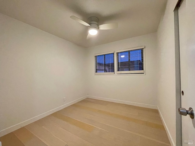 unfurnished room with hardwood / wood-style flooring and ceiling fan