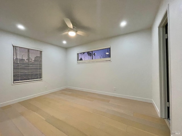 unfurnished room featuring ceiling fan and light hardwood / wood-style floors