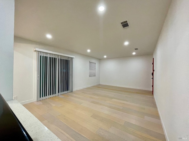 unfurnished room featuring light wood-type flooring