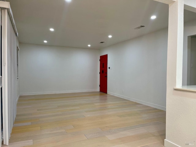 unfurnished room with light hardwood / wood-style floors