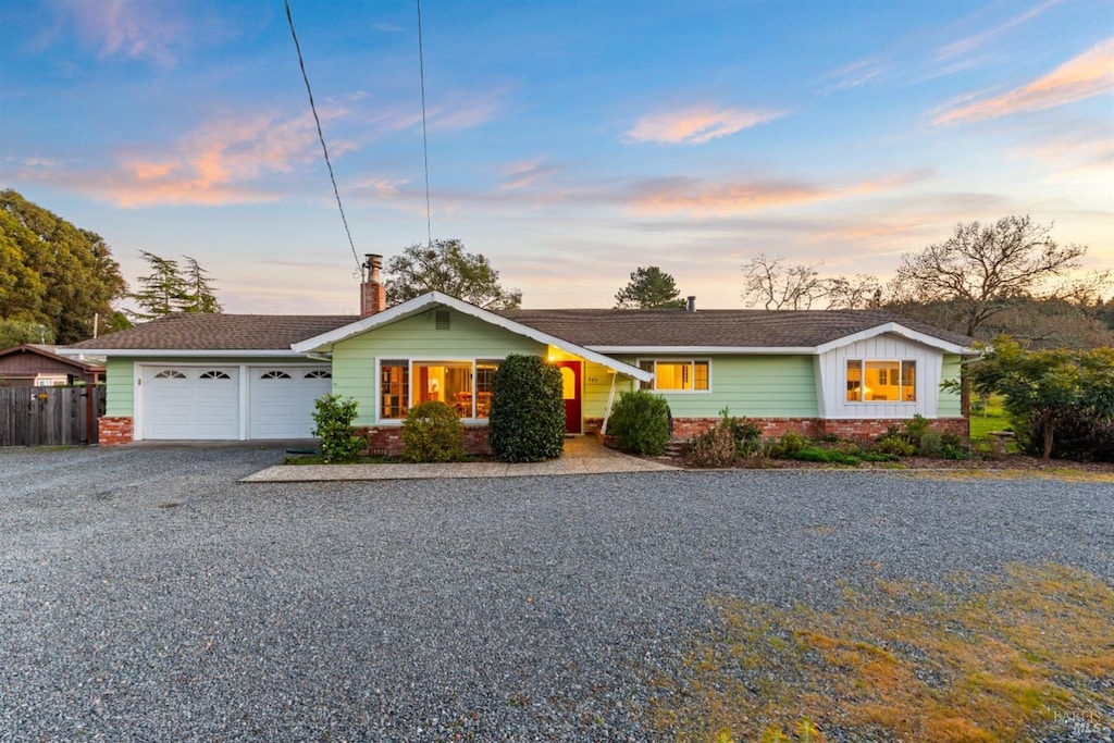 ranch-style house featuring a garage