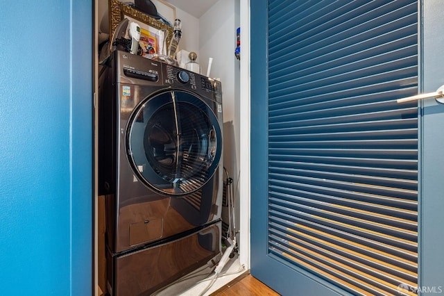 washroom with washer / clothes dryer and hardwood / wood-style flooring