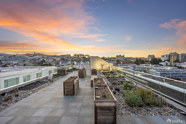 view of patio terrace at dusk