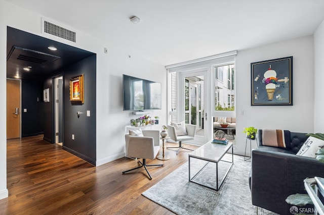 living room with dark hardwood / wood-style floors