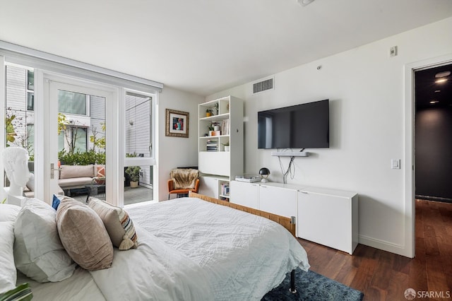 bedroom with dark hardwood / wood-style flooring and access to outside