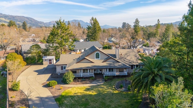 birds eye view of property with a mountain view