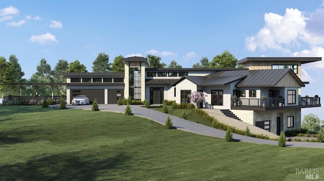 view of front facade with a garage and a front lawn