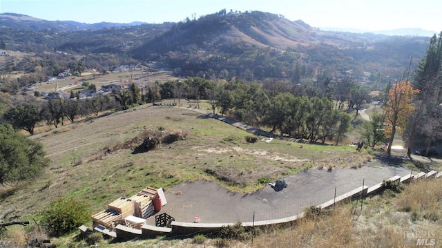 aerial view featuring a rural view and a mountain view