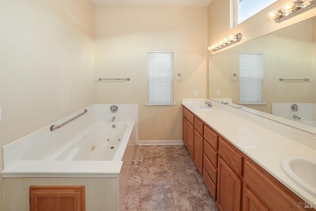 bathroom featuring a tub to relax in and vanity