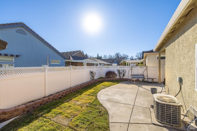 view of yard with a patio and central air condition unit