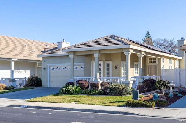 view of front of home featuring a garage and covered porch