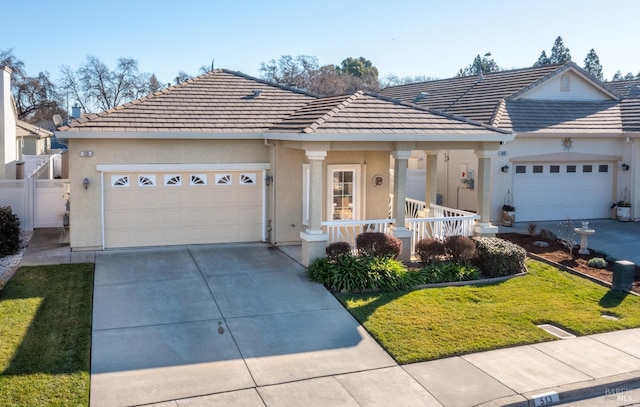 ranch-style home with a garage, a porch, and a front lawn