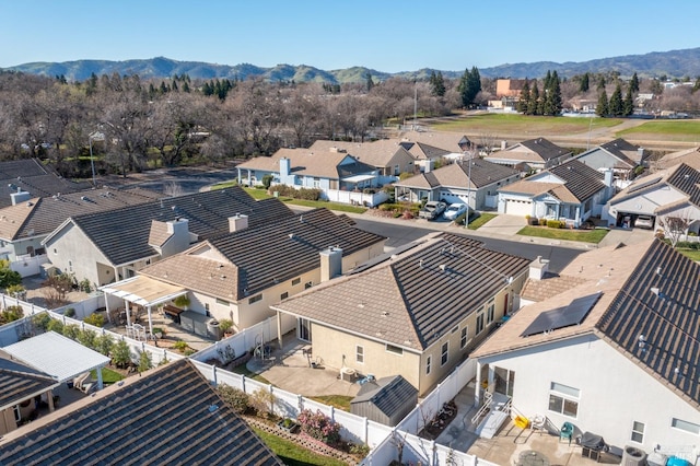 birds eye view of property with a mountain view