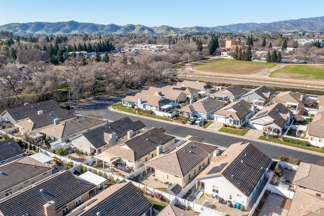 birds eye view of property with a mountain view