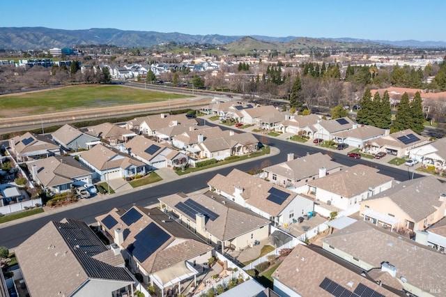 birds eye view of property with a mountain view