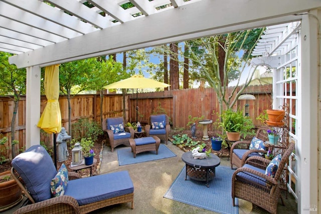 view of patio / terrace with a pergola and an outdoor living space with a fire pit