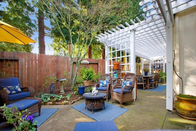 view of patio / terrace featuring a pergola and an outdoor living space with a fire pit