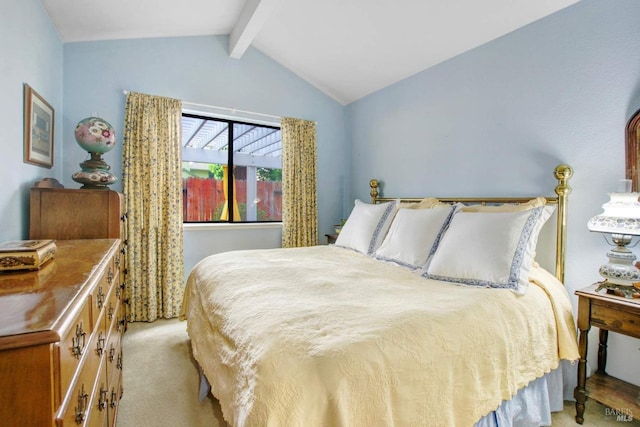 carpeted bedroom featuring lofted ceiling with beams