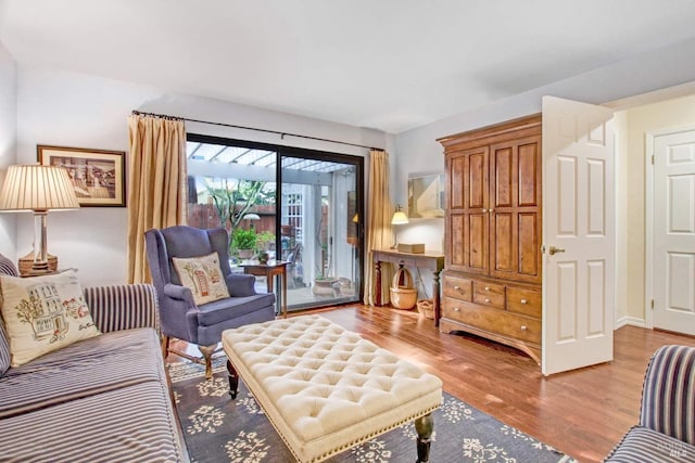 sitting room featuring hardwood / wood-style floors