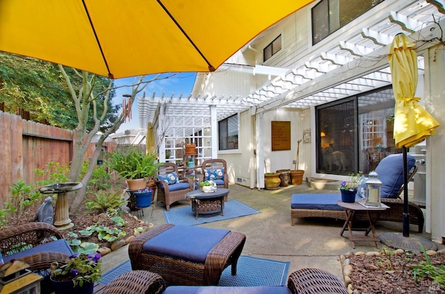 view of patio featuring a pergola and an outdoor living space with a fire pit