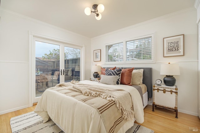 bedroom with light wood-style floors, access to outside, ornamental molding, and baseboards