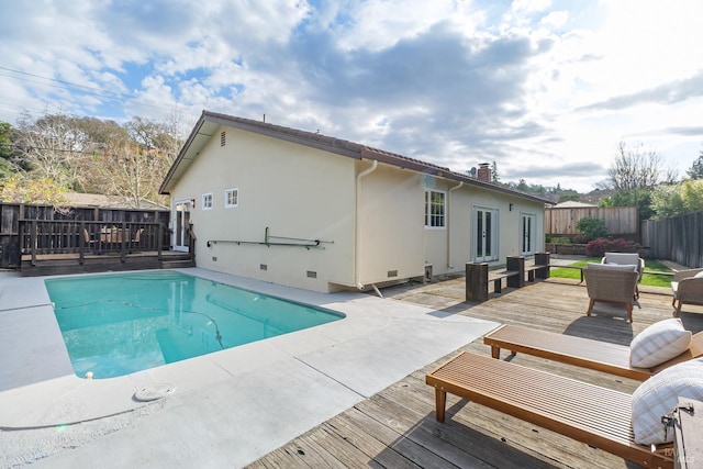 view of pool featuring a fenced in pool, fence private yard, an outdoor living space, and a deck