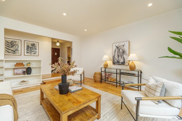 living room featuring ornamental molding, french doors, and light parquet floors