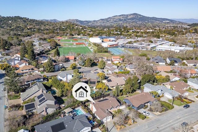 birds eye view of property with a residential view and a mountain view