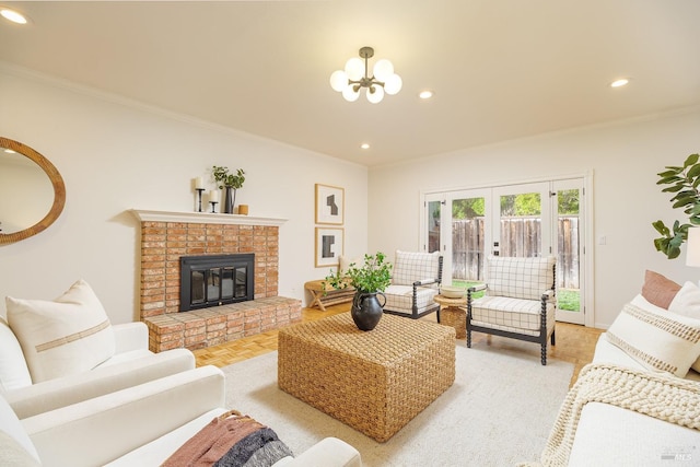 living area featuring recessed lighting, a brick fireplace, an inviting chandelier, and crown molding