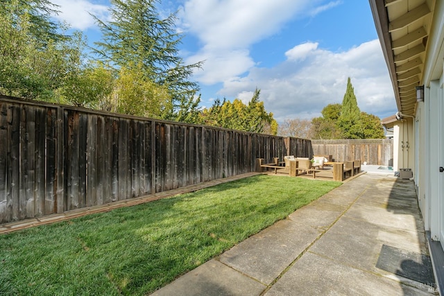 view of yard with a patio area, a fenced backyard, and outdoor lounge area