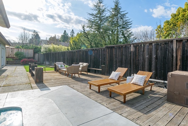 deck with a fenced backyard