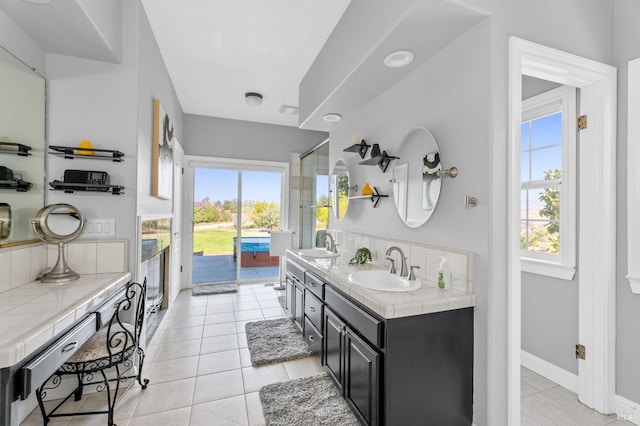 bathroom featuring tile patterned flooring and vanity