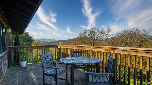 wooden terrace featuring a mountain view