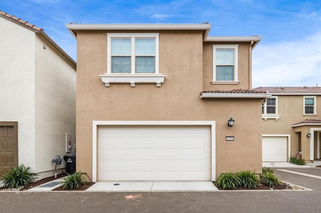 view of front of home with a garage