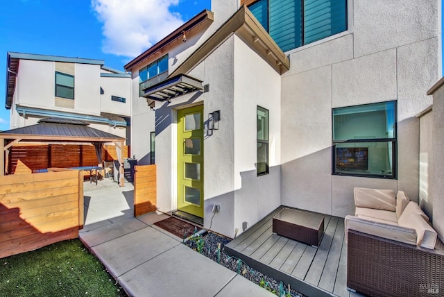 exterior space featuring a gazebo and outdoor lounge area