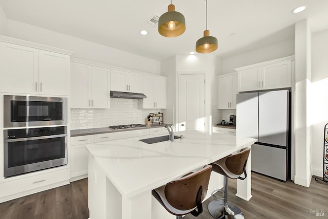 kitchen featuring white cabinetry, stainless steel appliances, and sink