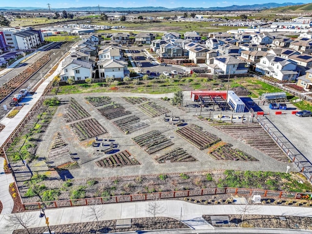 birds eye view of property featuring a mountain view