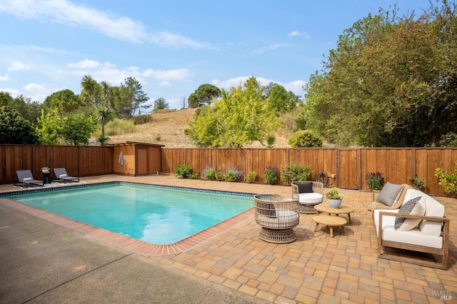 view of swimming pool featuring a patio