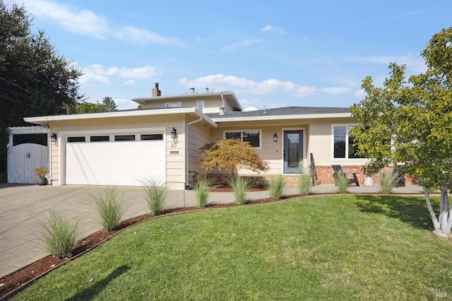 view of front of property featuring a garage and a front lawn