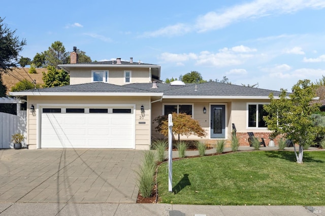 view of front facade featuring a garage and a front yard