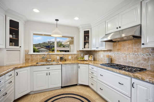 kitchen with stainless steel appliances, sink, decorative backsplash, and white cabinets