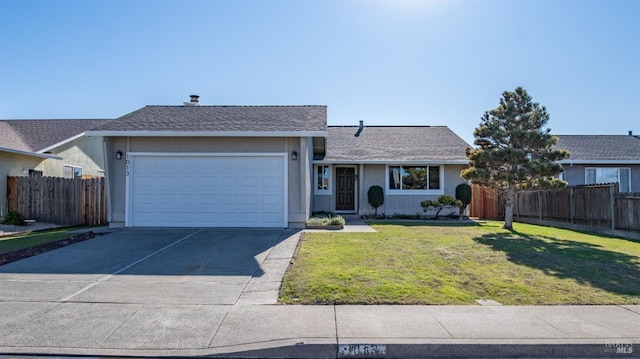 ranch-style home with a garage and a front lawn