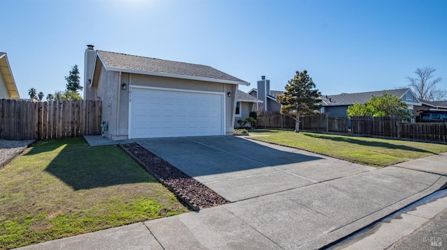 view of front facade featuring a garage and a front yard