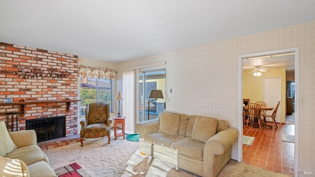 living room with a brick fireplace