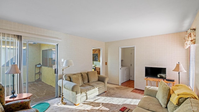 living room with washer and clothes dryer