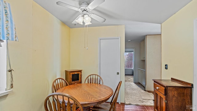 dining space featuring ceiling fan