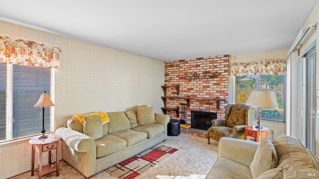 living room featuring light colored carpet and a brick fireplace