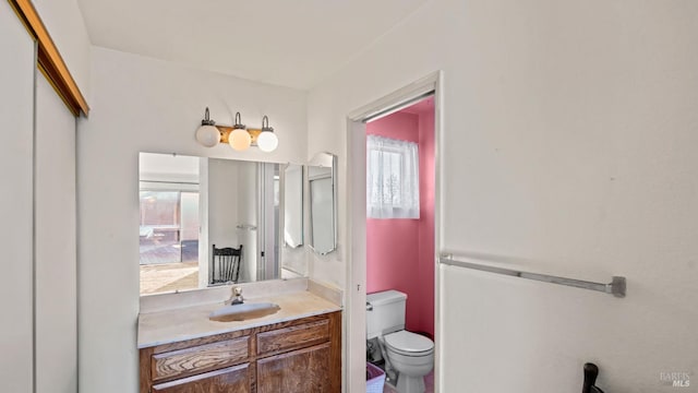 bathroom with vanity and toilet